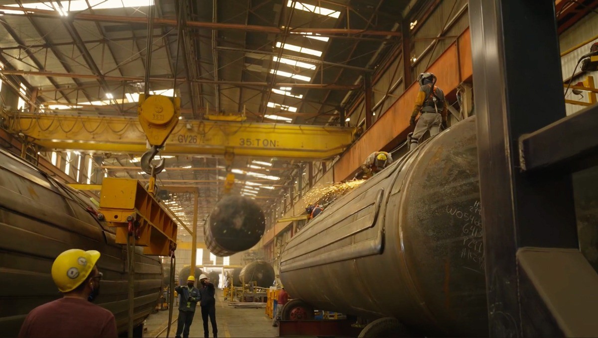 Welders working in the manufacturing plant.
