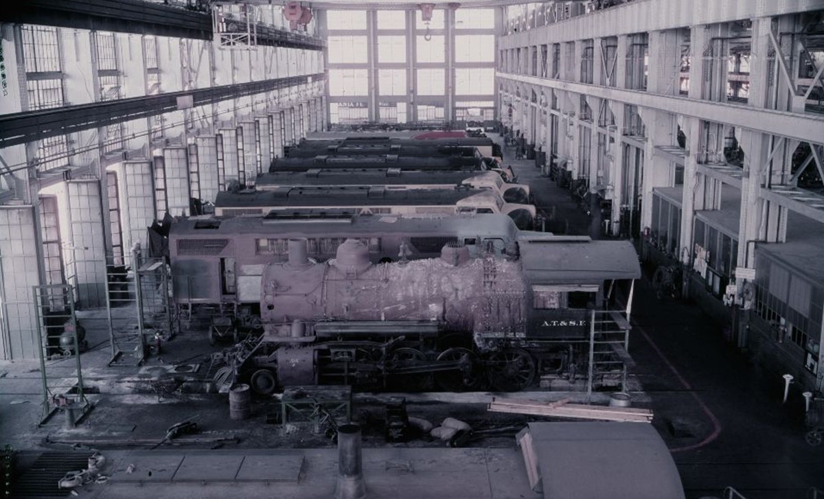 Aerial view of Santa Fe locomotives with a steam locomotive in the middle