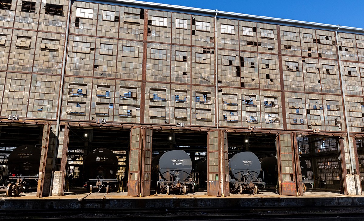 GBX black tank cars inside the large railcar workshop