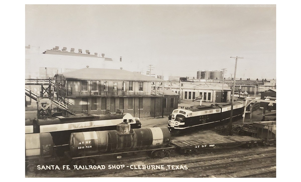 Vintage photo of tank cars and locomotives outside of the Santa Fe rail shop